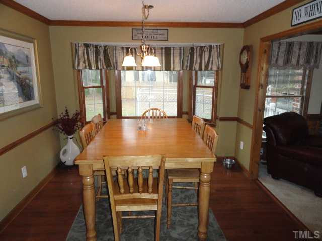 1760 Ranch Road Clayton, NC 27520 - Photo 5 of 18 a dining room with furniture and window