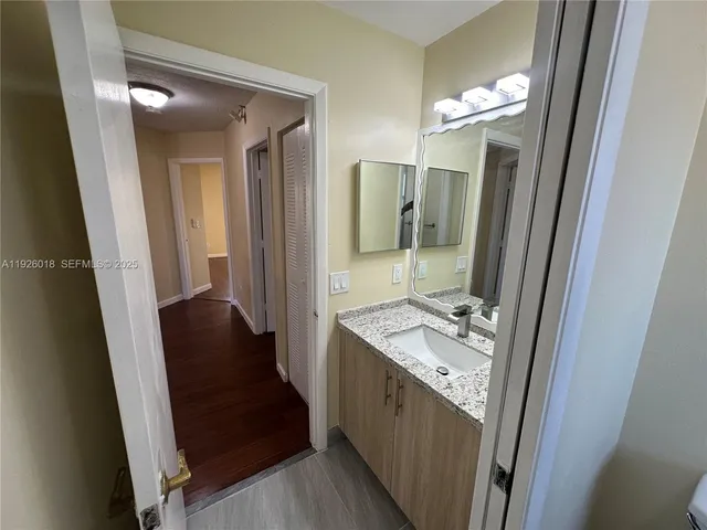a bathroom with sink and mirror
