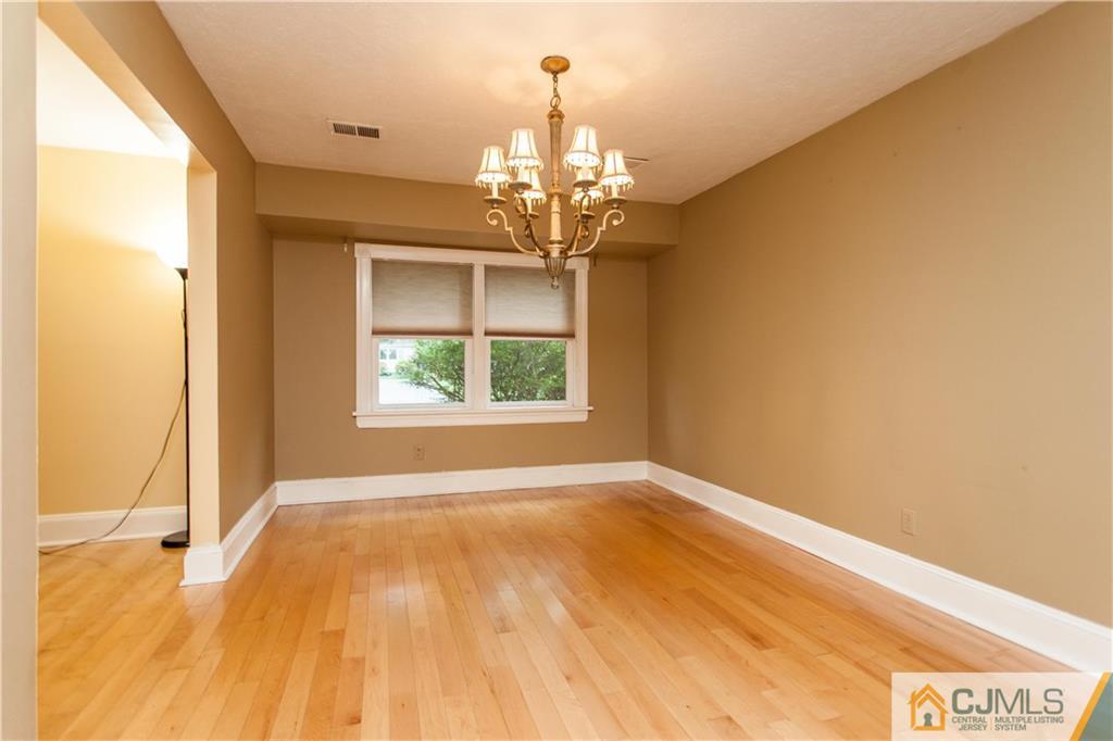 29 Maida Road Edison, NJ 08820 - Photo 4 of 17 a view of a room with wooden floor chandelier and a window