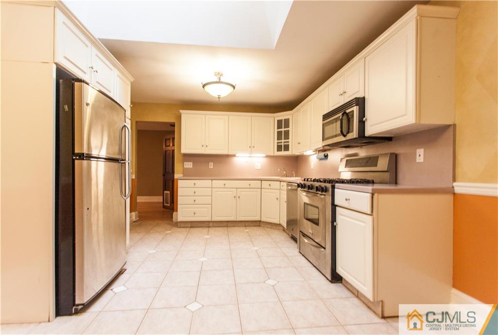 29 Maida Road Edison, NJ 08820 - Photo 6 of 17 a kitchen with stainless steel appliances a refrigerator sink and cabinets