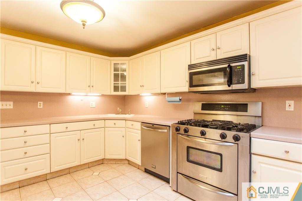 29 Maida Road Edison, NJ 08820 - Photo 7 of 17 a kitchen with granite countertop cabinets stainless steel appliances and a counter space