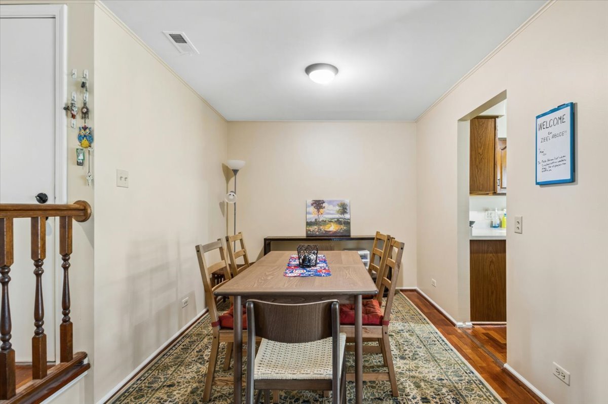 166 Hemingway Court, Unit 252 Vernon Hills, IL 60061 - Photo 7 of 18 a view of a dining room with furniture