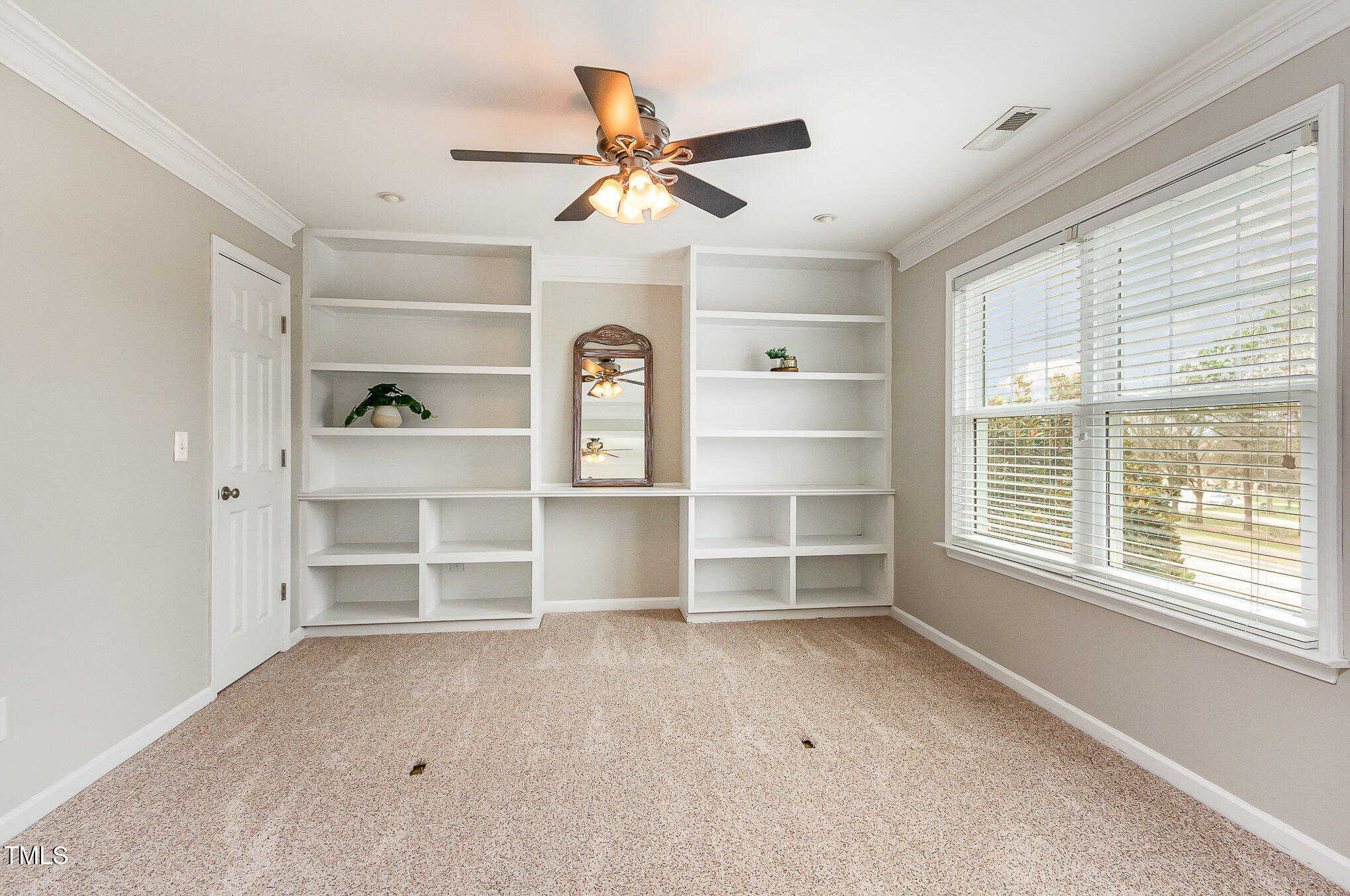 405 Challenge Road Raleigh, NC 27603 - Photo 13 of 24 a view of an empty room and a window