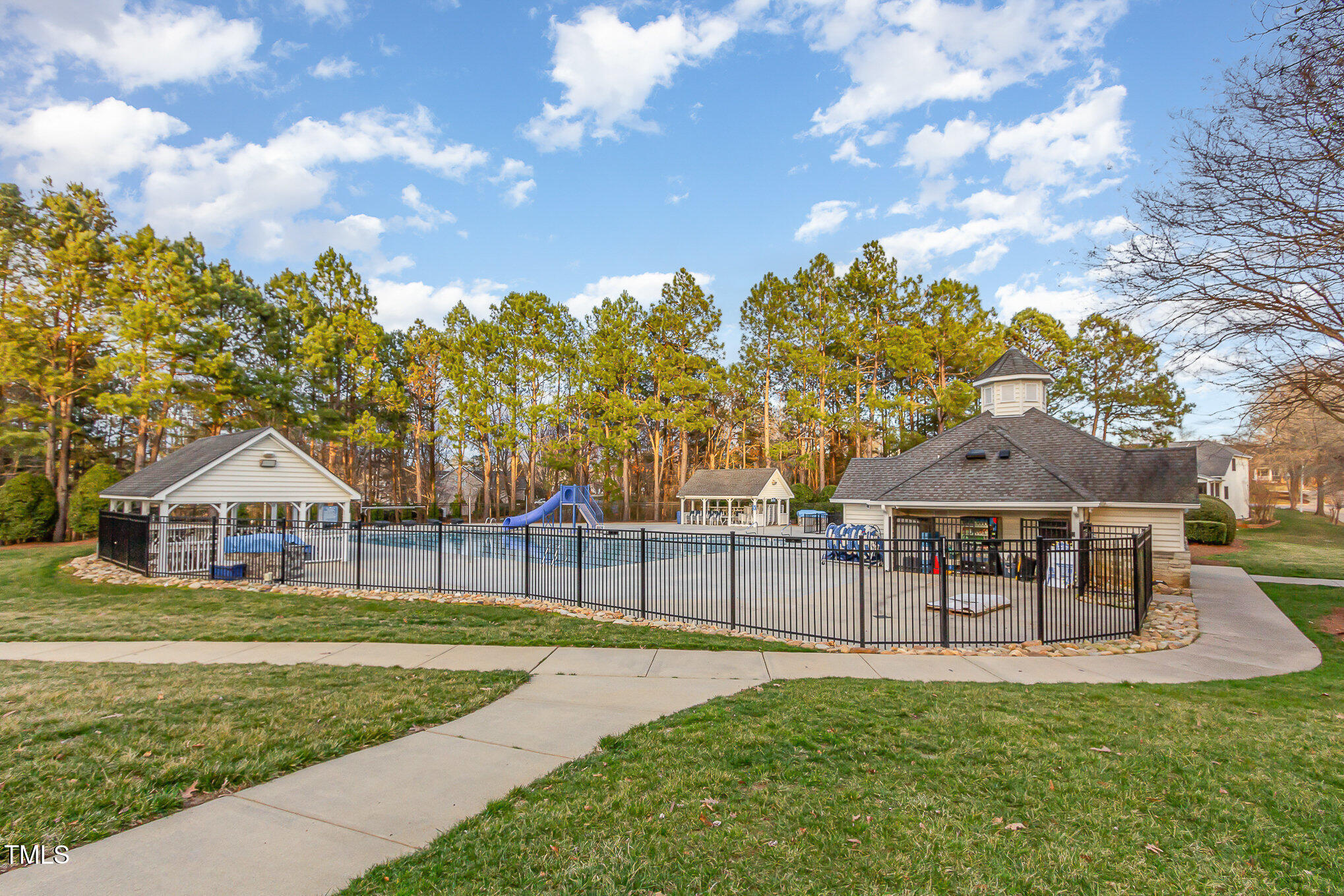 405 Challenge Road Raleigh, NC 27603 - Photo 21 of 24 a view of a house with a yard porch and sitting area