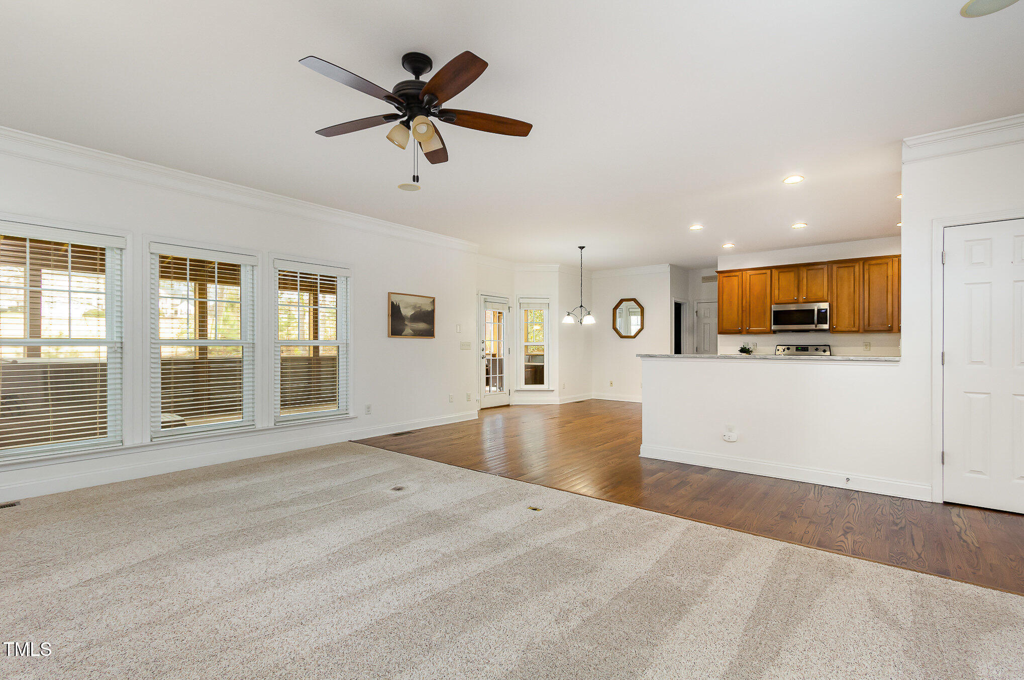 405 Challenge Road Raleigh, NC 27603 - Photo 5 of 24 a view of an empty room with a window and a kitchen