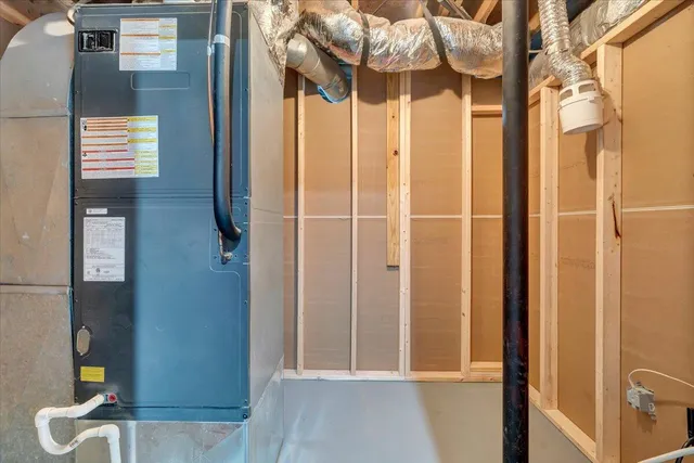 a view of a yard with wooden fence