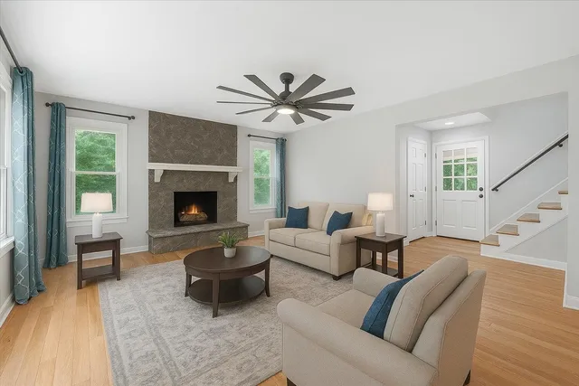 a view of empty room with wooden floor and window