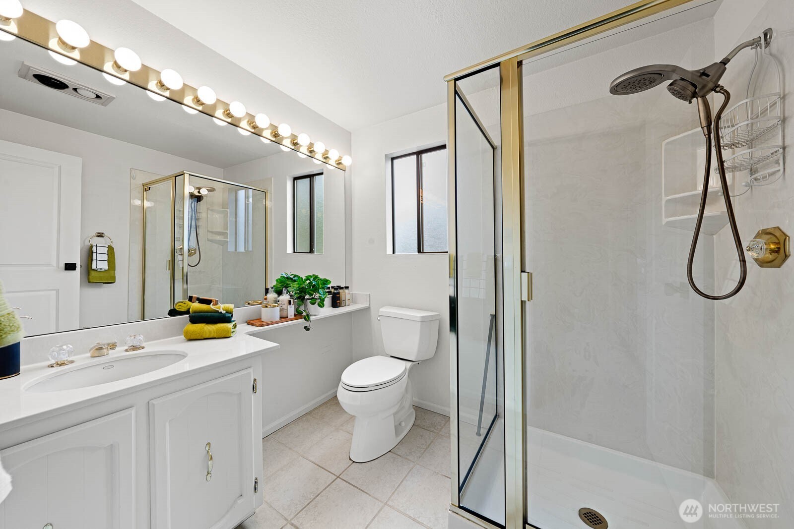 22520 4th Avenue Southeast Bothell, WA 98021 - Photo 21 of 35 a bathroom with a double vanity sink toilet mirror and shower