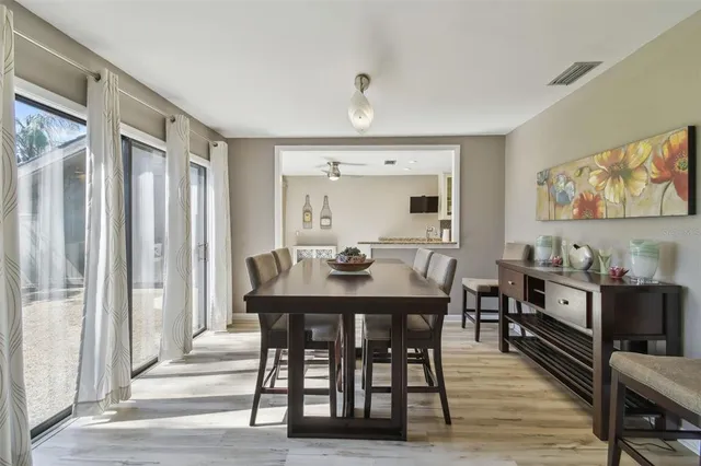 a kitchen with stainless steel appliances granite countertop a sink and a stove