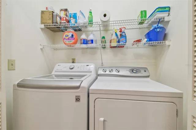 a spacious bedroom with a bed and a dresser