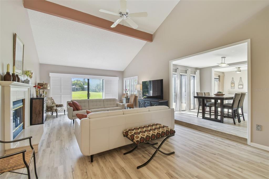 5434 Kemkerry Road Wesley Chapel, FL 33543 - Photo 2 of 56 a living room with furniture and a flat screen tv