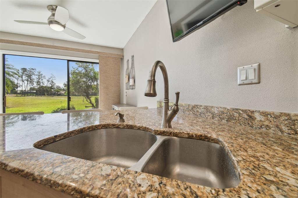 5434 Kemkerry Road Wesley Chapel, FL 33543 - Photo 21 of 56 a kitchen with a sink and a window