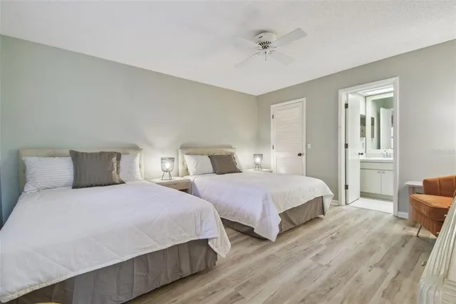 a bedroom with a large bed and a tv