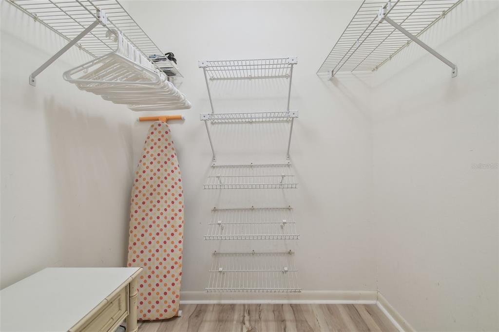 5434 Kemkerry Road Wesley Chapel, FL 33543 - Photo 25 of 56 a view of walk in closet with empty racks