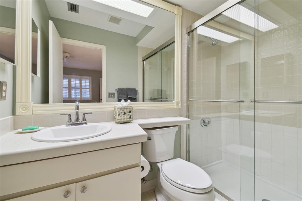 5434 Kemkerry Road Wesley Chapel, FL 33543 - Photo 26 of 56 a bathroom with a sink toilet vanity and shower