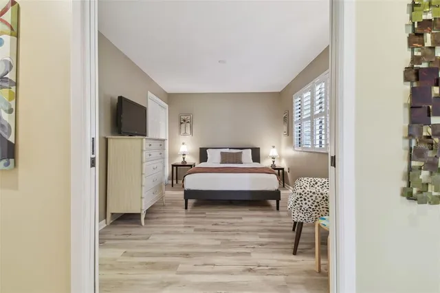 a bathroom with a toilet sink vanity and mirror