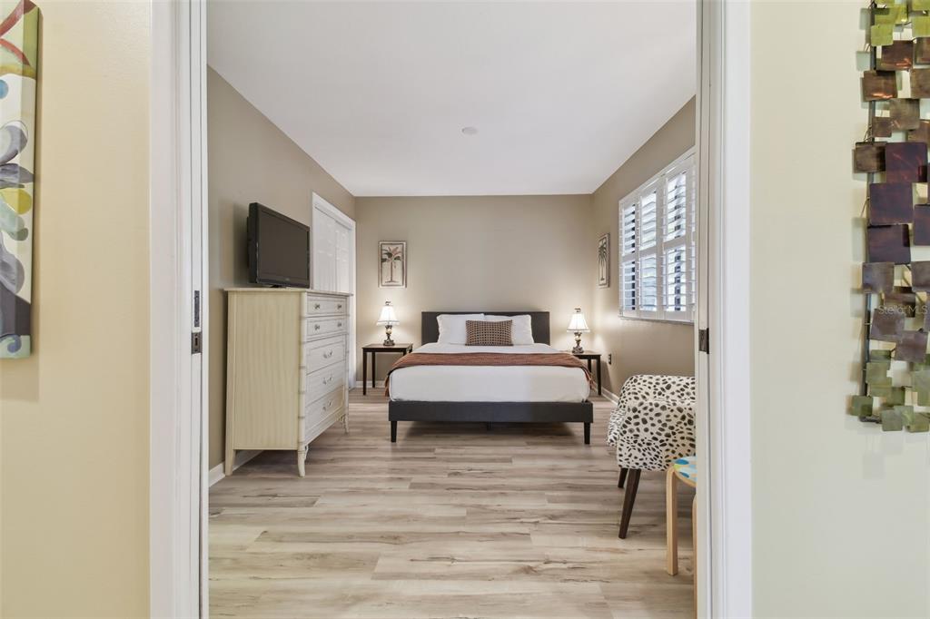 5434 Kemkerry Road Wesley Chapel, FL 33543 - Photo 29 of 56 a bedroom with a bed and a flat screen tv