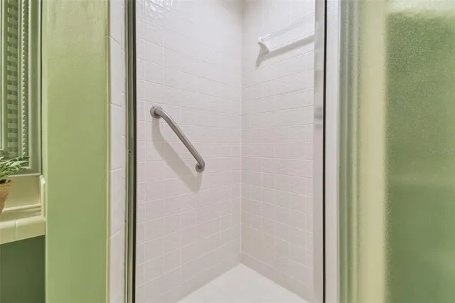 a front view of a house with a garden and yard