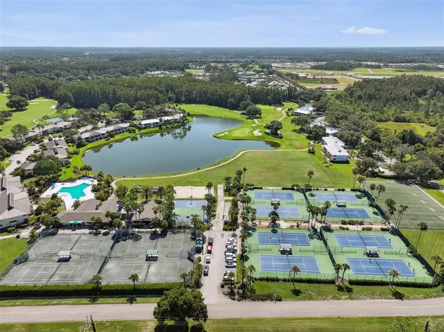 an aerial view of a house with a swimming pool yard and outdoor seating