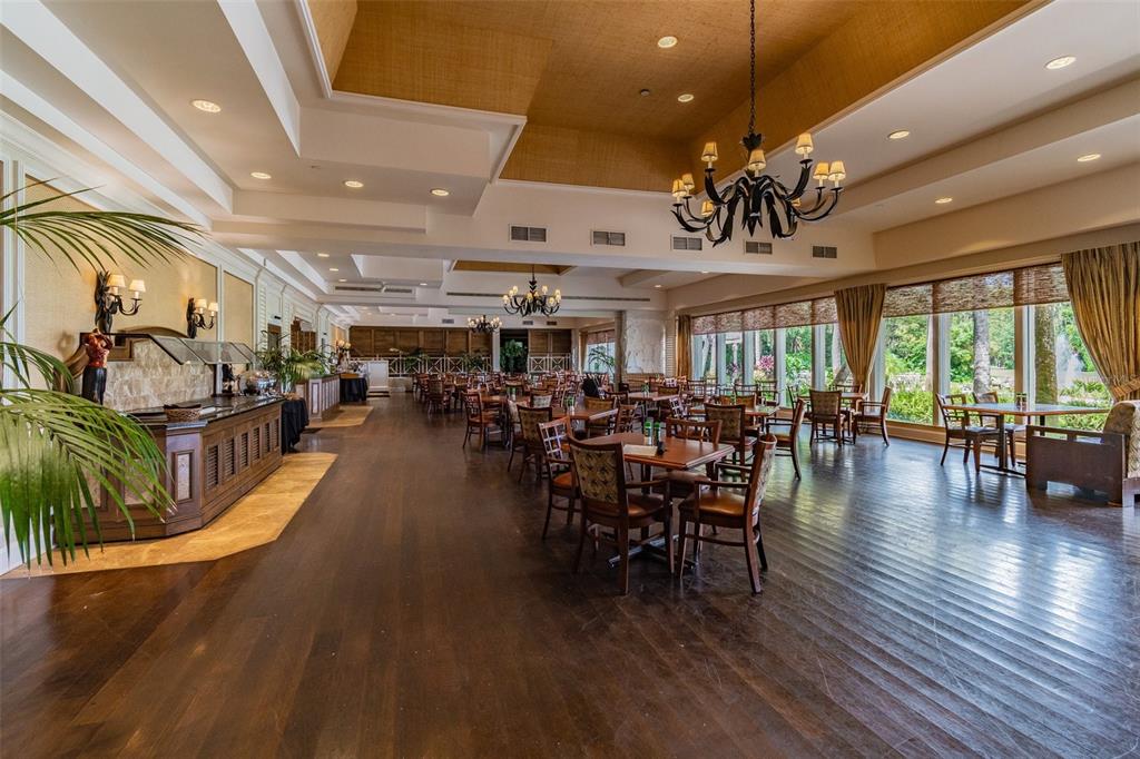 5434 Kemkerry Road Wesley Chapel, FL 33543 - Photo 53 of 56 a view of a dining room with furniture window and wooden floor