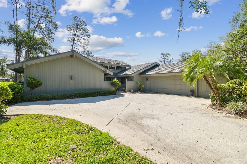 5434 Kemkerry Road Wesley Chapel, FL 33543 - Photo 9 of 56 a house view with a backyard space