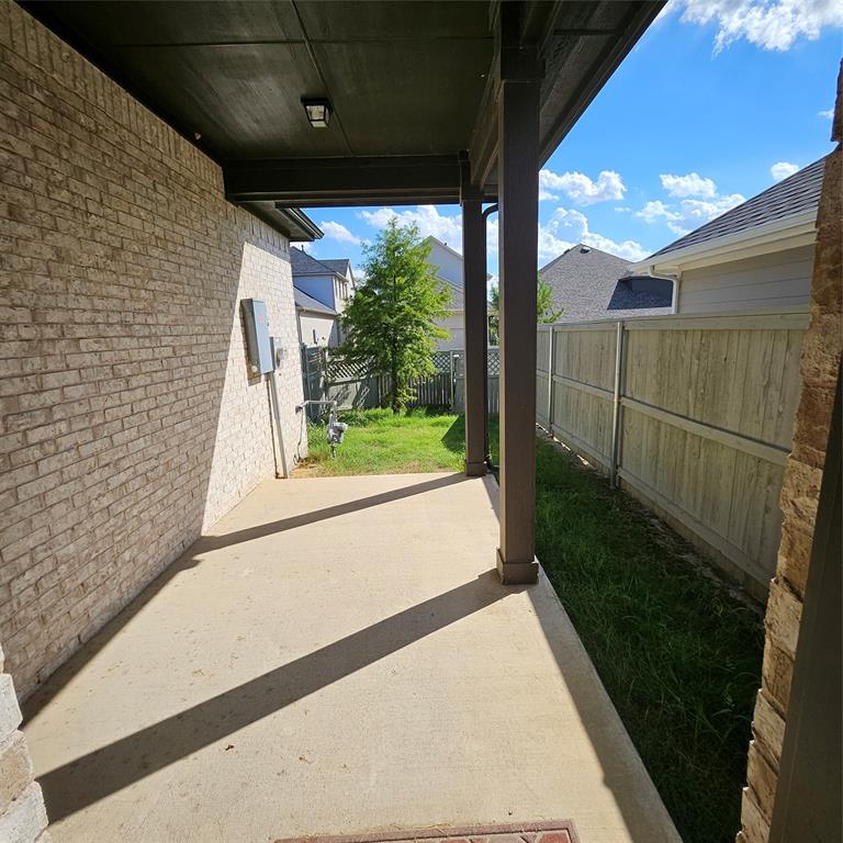 2309 Jack Rabbit Way Northlake, TX 76247 - Photo 26 of 28 Covered patio featuring concrete flooring and a light-colored brick exterior