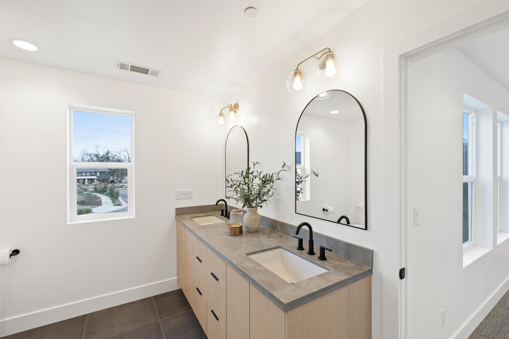 2450 Neighborly Way Redding, CA 96001 - Photo 22 of 48 a bathroom with a double vanity sink and a mirror