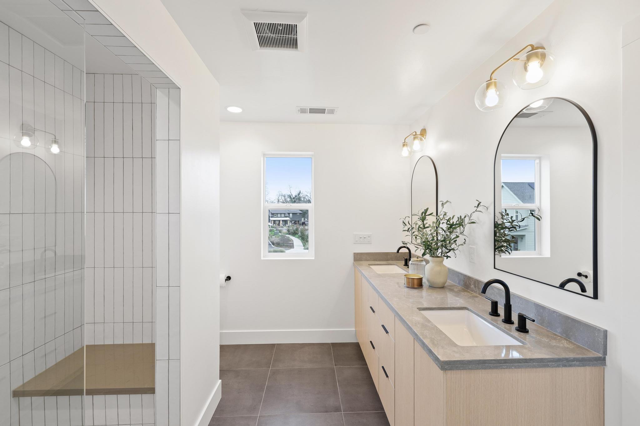 2450 Neighborly Way Redding, CA 96001 - Photo 23 of 48 a bathroom with a double vanity sink a mirror and a shower