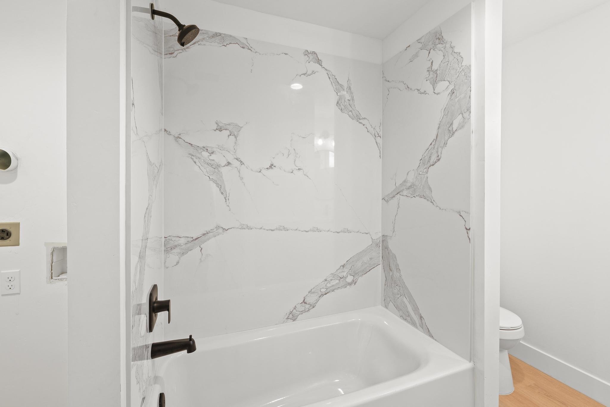 2450 Neighborly Way Redding, CA 96001 - Photo 30 of 48 a bathroom with a bathtub and shower