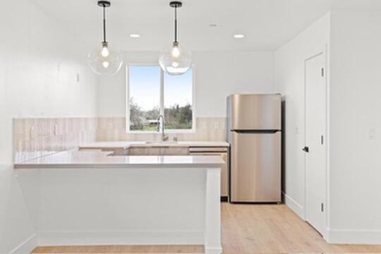 2450 Neighborly Way Redding, CA 96001 - Photo 34 of 48 a kitchen with refrigerator and window