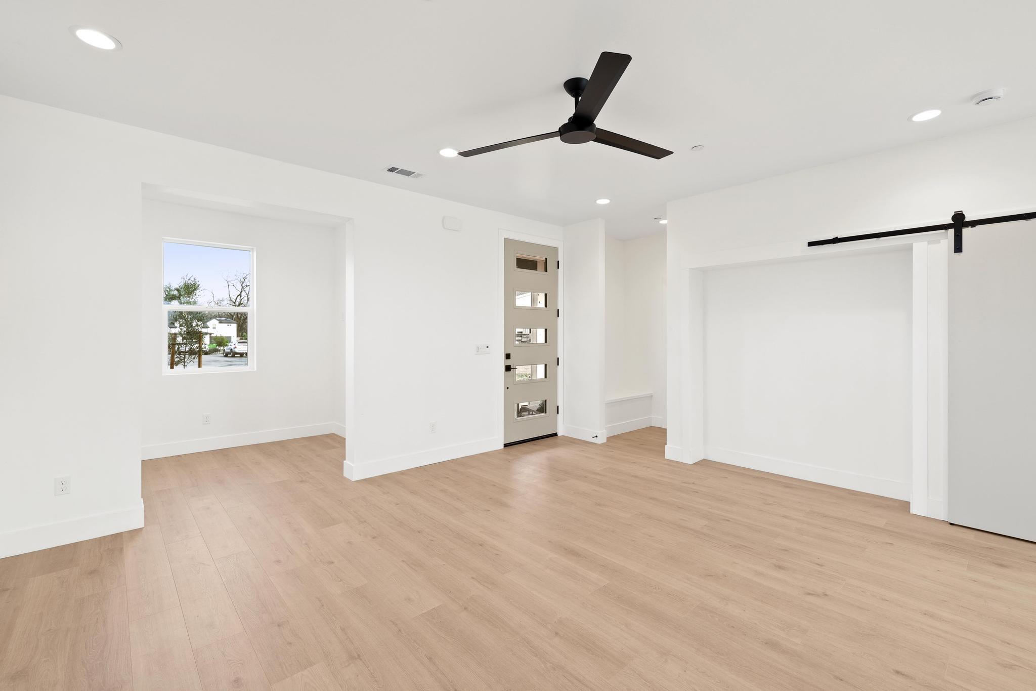 2450 Neighborly Way Redding, CA 96001 - Photo 5 of 48 a view of a livingroom with a ceiling fan & entryway