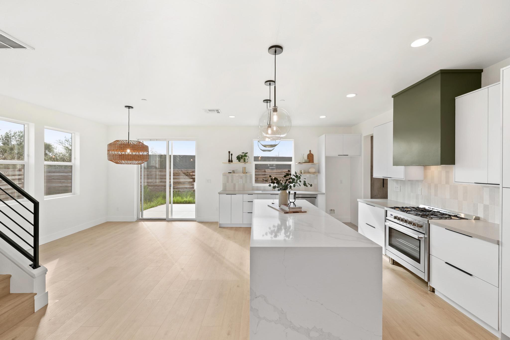 2450 Neighborly Way Redding, CA 96001 - Photo 7 of 48 a open kitchen with stainless steel appliances granite countertop a sink dishwasher a stove and a refrigerator with wooden floor