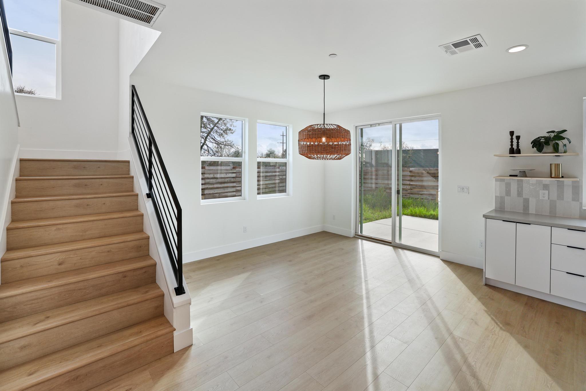 2450 Neighborly Way Redding, CA 96001 - Photo 8 of 48 a view of empty room with wooden floor and fan
