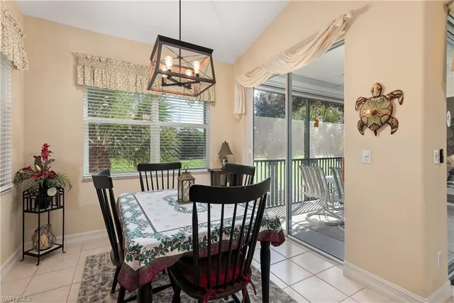 a view of a dining room with furniture window and outside view
