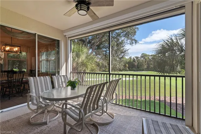 a view of a chair and table in the balcony