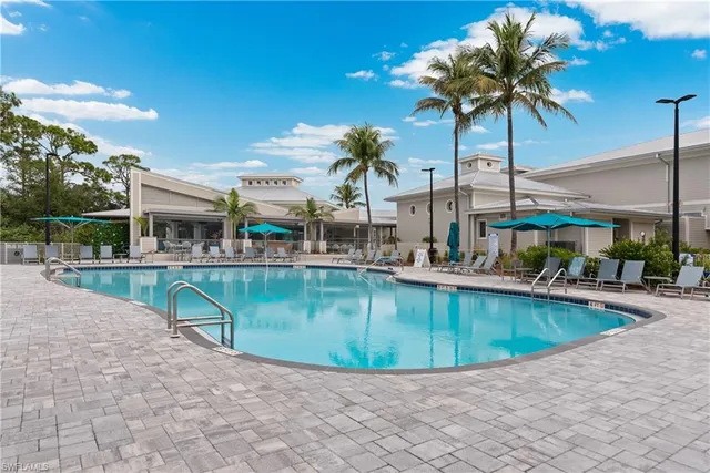 a view of a swimming pool with a lounge chairs