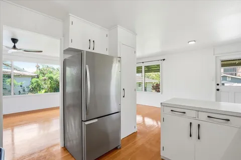 a white refrigerator freezer sitting in a kitchen