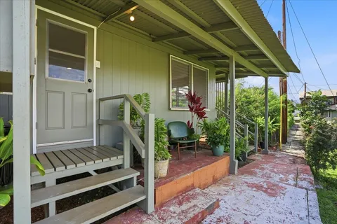 a backyard of a house with seating space