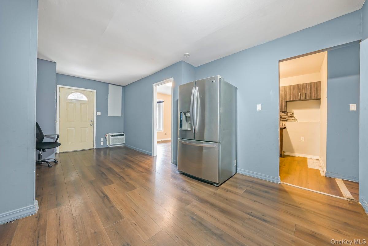 130-24 Springfield Boulevard Queens, NY 11413 - Photo 5 of 20 a view of empty room with wooden floor and window
