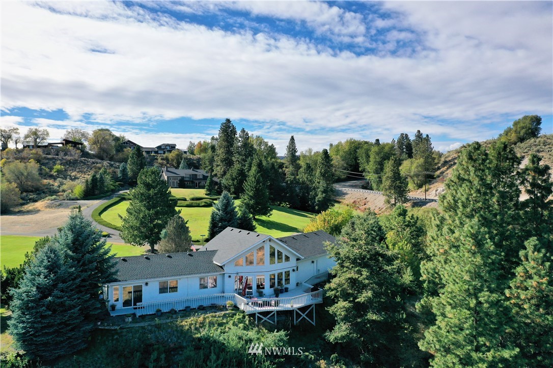 9 Hahn Road Omak, WA 98841 - Photo 1 of 34 aerial view of a house with a garden and lake view