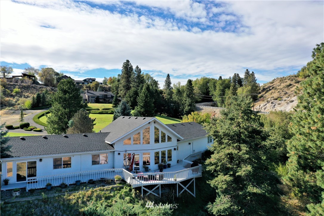 9 Hahn Road Omak, WA 98841 - Photo 8 of 34 an aerial view of a house with swimming pool and furniture