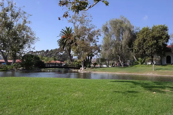 a view of swimming pool is middle in the garden
