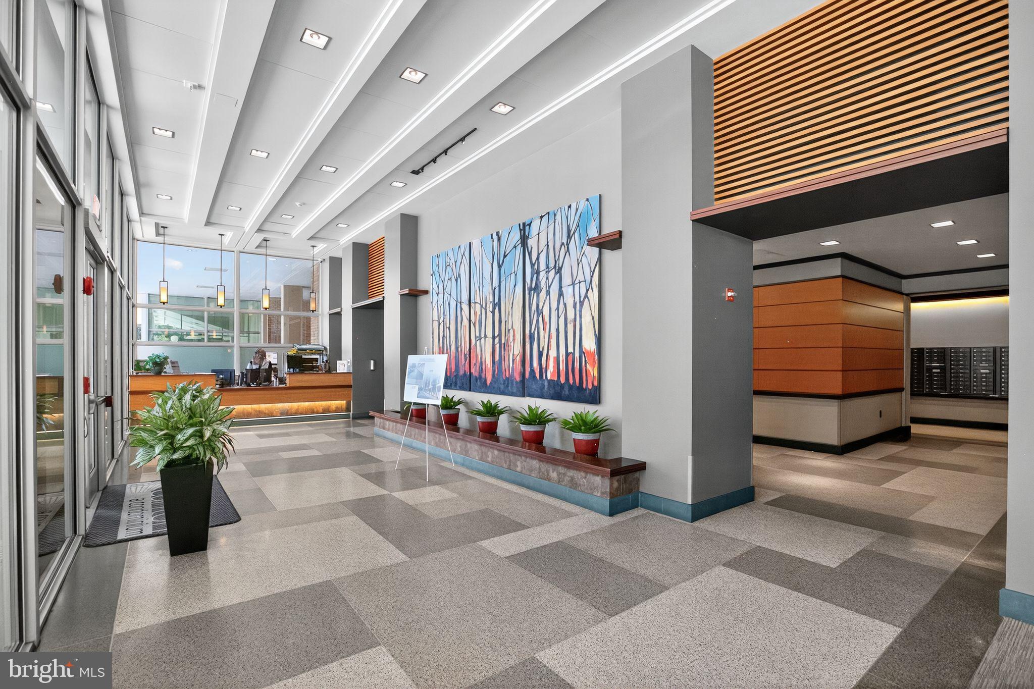 4600 South Four Mile Run Drive, Unit 421 Arlington, VA 22204 - Photo 4 of 17 Modern lobby with artistic wall mural.