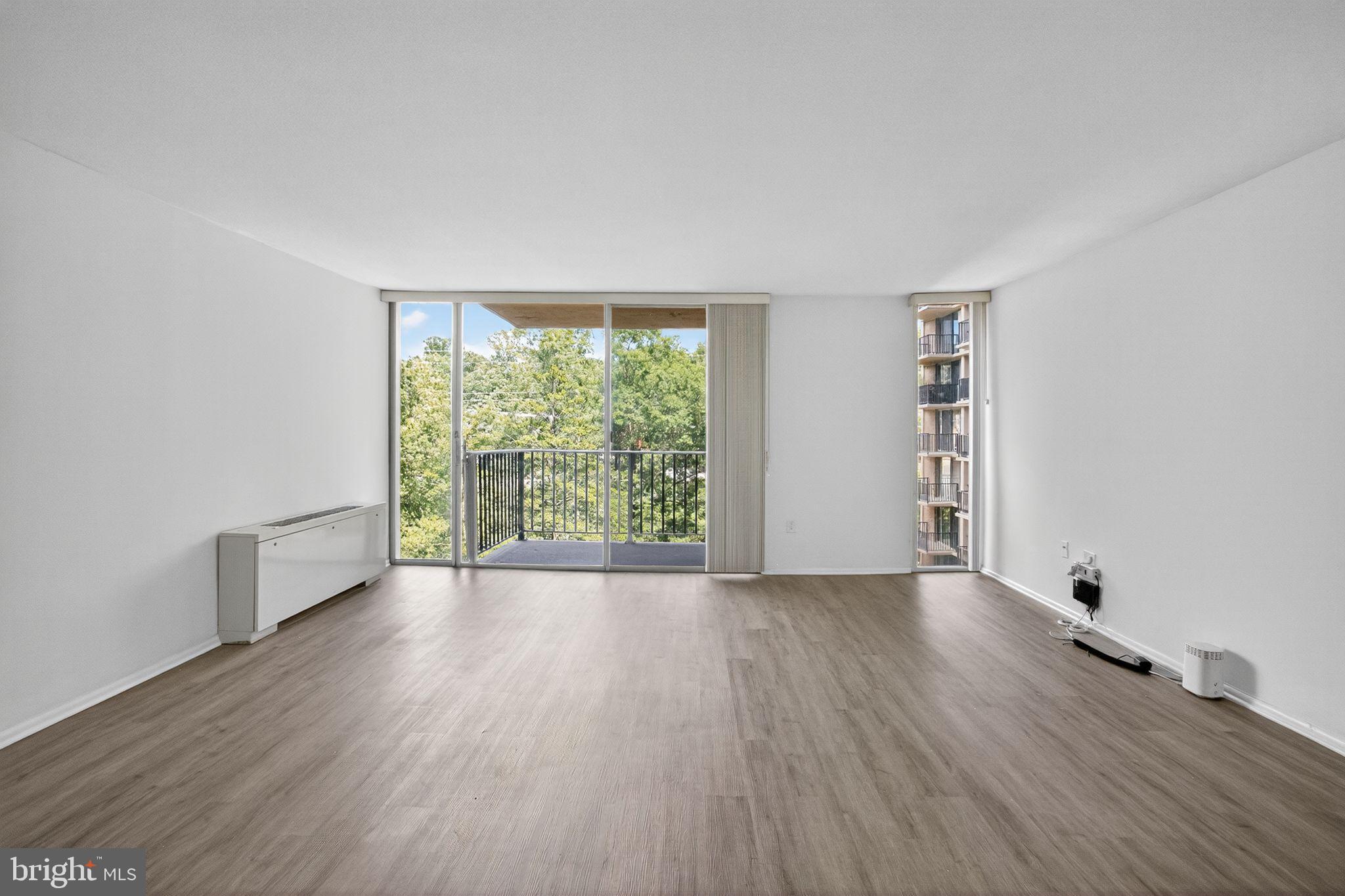 4600 South Four Mile Run Drive, Unit 421 Arlington, VA 22204 - Photo 7 of 17 Bright and airy space with scenic views.