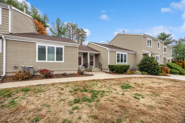 a front view of a house with a yard
