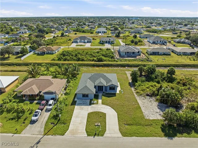 an aerial view of a house with a lake view