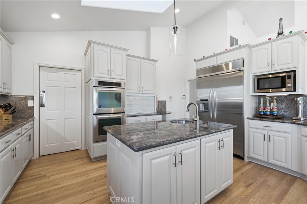 8325 Delgany Avenue Playa del Rey, CA 90293 - Photo 11 of 50 a kitchen with stainless steel appliances granite countertop a sink stove and refrigerator