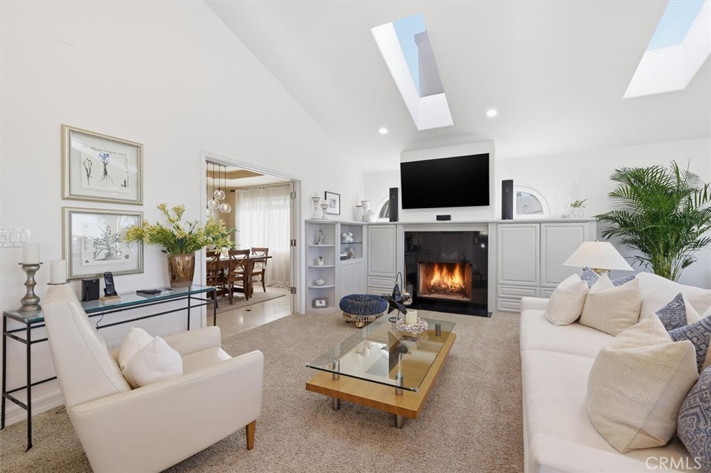 8325 Delgany Avenue Playa del Rey, CA 90293 - Photo 16 of 50 a living room with furniture a flat screen tv and a fireplace