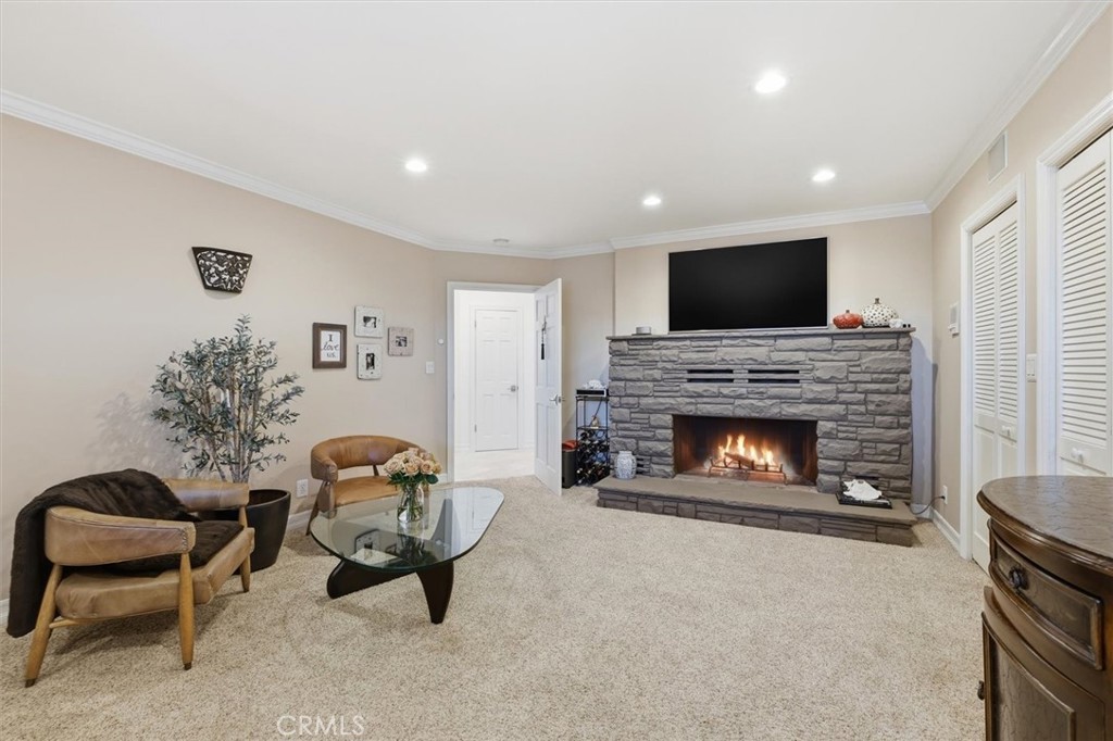 8325 Delgany Avenue Playa del Rey, CA 90293 - Photo 23 of 50 a living room with furniture a flat screen tv and a fireplace