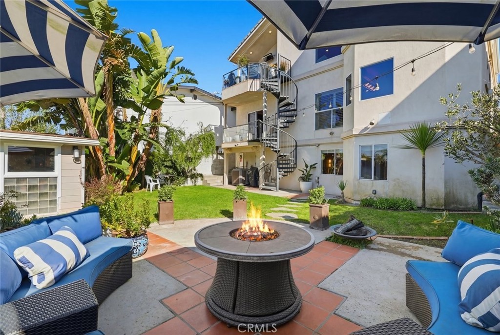 8325 Delgany Avenue Playa del Rey, CA 90293 - Photo 34 of 50 a view of a patio with couches table and chairs and potted plants